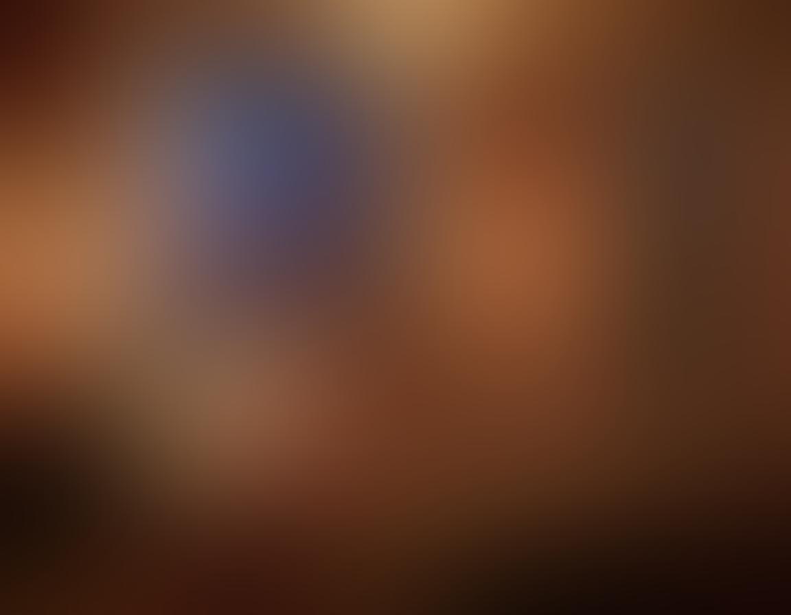 A sensual and inviting bedroom setting, with soft, dim lighting and plush fabrics creating an atmosphere of intimacy. Include a beautiful couple embracing, surrounded by romantic elements like candles, scattered rose petals, and artful erotic sculptures. Emphasize feelings of passion and connection, with hints of a dreamy sunset visible through a window. rich colors. painting. intimate style.